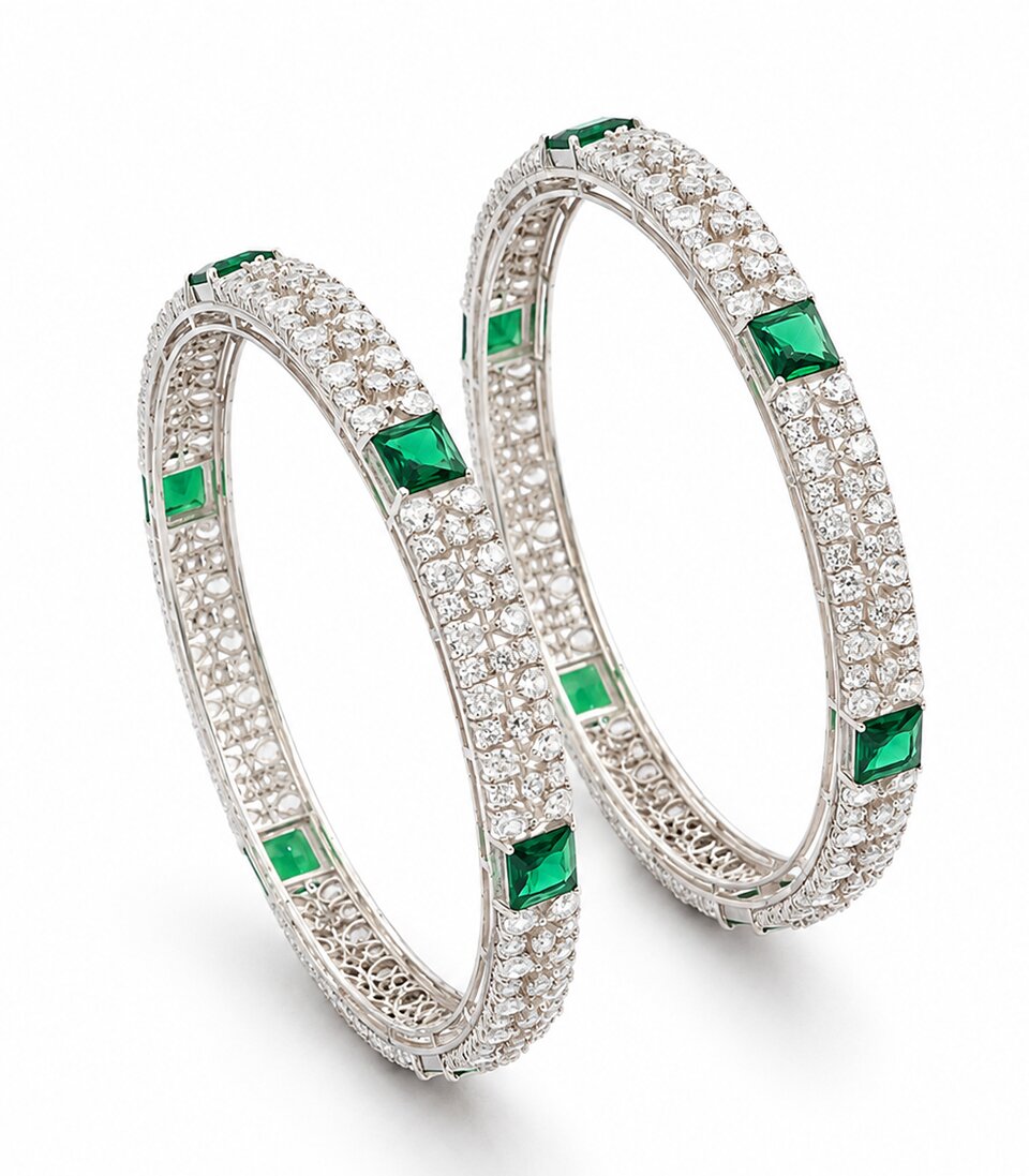 Pair Of Diamond Bangles With Green Gemstones and Foral Patterns